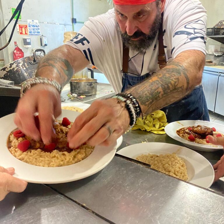 Private chef plating a gourmet dish in Puerto Morelos kitchen